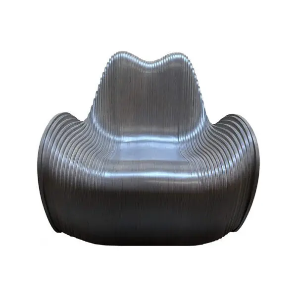 Metallic ribbed lounge chair with a curved back and wide seat, sculptural design.