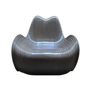 Ribbed metallic lounge chair with a curved, shell-like shape and wide armrests against a white background