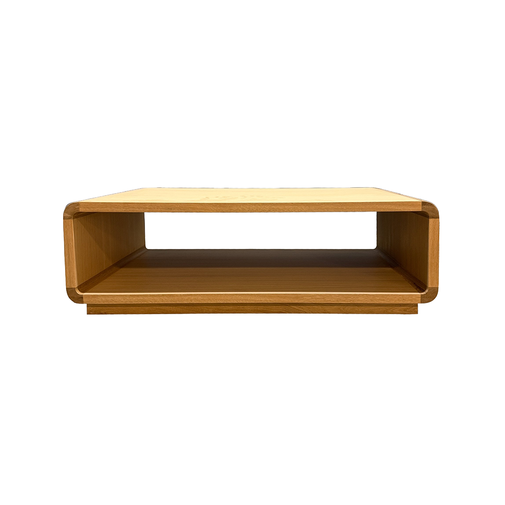 Wooden low coffee table with an open front storage shelf and rounded corners.